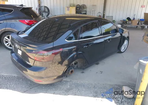 2013 Ford Focus Titanium z USA, uszkodzony, nr VIN 1FADP3J20DL143491